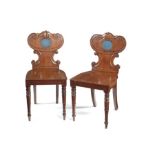 A pair of Regency mahogany hall chairs