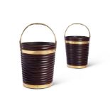 A pair of rare large Irish Regency mahogany and brass bound peat buckets