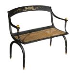 A late 19th century Empire style ebonised and parcel gilt settee