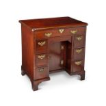 A George II mahogany kneehole fitted dressing table