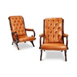 A matched pair of Regency mahogany library open armchairs