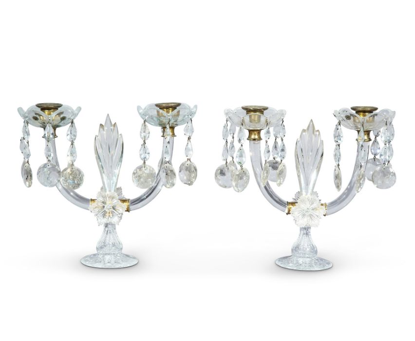 A pair of George IV cut-glass lustre twin-light candelabra
