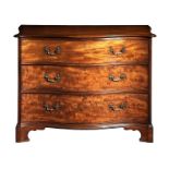 A George III mahogany serpentine chest attributed to Thomas Chippendale