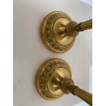 A pair of Louis XVI gilt bronze candlesticks