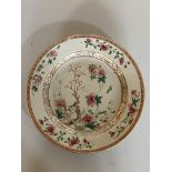 Three Cantonese plates, a cantonese brush pot and famille rose plate