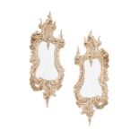 A pair of late 19th century rococo style carved mirrors