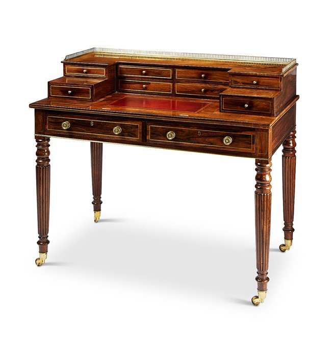 A Regency rosewood and brass inlaid writing desk