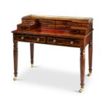 A Regency rosewood and brass inlaid writing desk