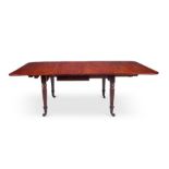 A George IV mahogany drop-flap extending dining table by A Solomon
