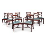 A set of eight Regency mahogany dining chairs including a pair of open armchairs