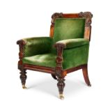 A George IV carved rosewood library armchair the design by John Taylor