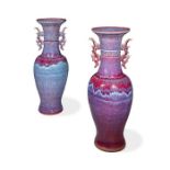 A pair of large Chinese floor standing purple flambé vases