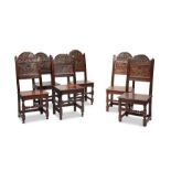 A well matched set of six Charles II oak solid-seat chairs, Lancashire