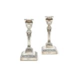 A pair of Edwardian silver candlesticks by Walker and Hall, Sheffield, 1904
