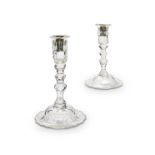 A pair of late 19th century George III style cut glass candlesticks