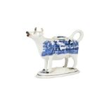A 19th century Staffordshire blue and white willow pattern cow creamer