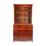A George III mahogany, satinwood and purplewood banded secretaire bookcase