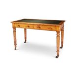 An early Victorian oak and bird's-eye maple writing table by Holland & Sons