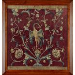 An 18th century needlework panel in a later frame