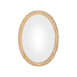 A George III oval giltwood carved frame with later mirror plate