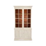 A Victorian later light grey painted bookcase cabinet
