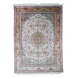 A Qum silk carpet, Central Persia, mid 20th century
