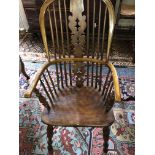 A set of eight late 19th/early 20th century yew-wood windsor open armchairs