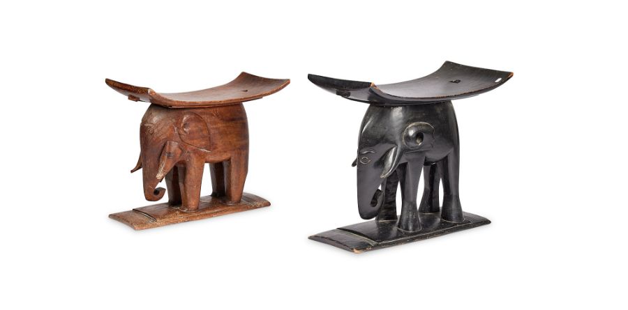 An ebonised tribal elephant stool and another similar carved hardwood example