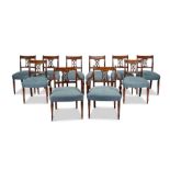 A set of ten Regency mahogany carved dining chairs, including a pair of open armchairs