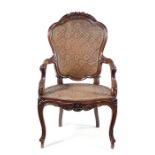 A mid 19th century Chinese export padouk armchair in the Louis XV style