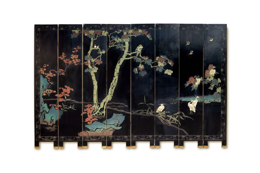 A late 19th century Chinese black and polychrome coromandel lacquer eight-fold screen