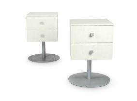 A pair of Aram ‘Cubo’ white laminate revolving bedside tables