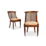 A pair of Regency simulated rosewood bergère side chairs