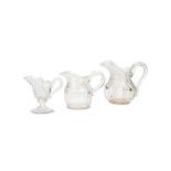 Three early 19th century English cut glass water jugs