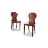 A pair of Regency mahogany hall chairs