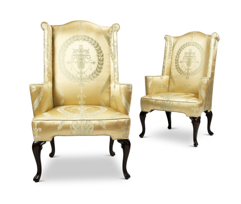 A pair of 20th century Queen Anne style mahogany wing armchairs