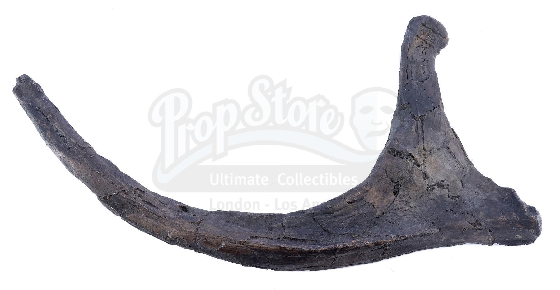 Lot # 813: JURASSIC WORLD - Torch Dinosaur Bone