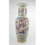 A large Chinese famille rose vase, with raised dragons to the shoulders, enamelled with butterflies,