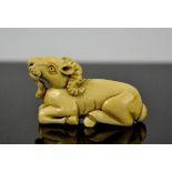 A Chinese carved ivory netsuke, in the form of a ram, signed to the base, circa 1900, 3cm high.