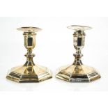 A pair of silver candlesticks, with weighted bases, Edinburgh, indistinct date mark, with