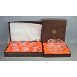 A boxed set of six crystal tumblers together with a boxed crystal bowl