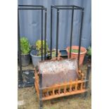 An antique fire grate and two modern log stands, 114cm high.