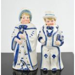 A pair of vintage ceramic bobble head nodder figures. 16cms tall