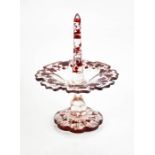 A bohemian glass ring stand, with red grape and vine design, 12cm high.