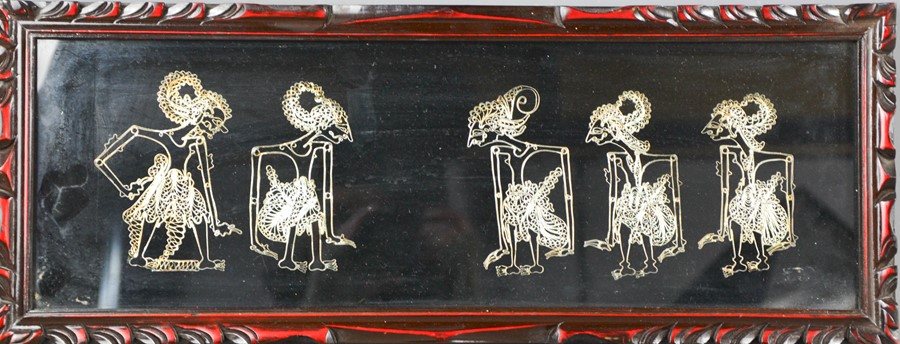 An Indonesian silvered thread needlework panel, depicting five figures, 16 by 49cm.