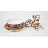 An Imari plate and matching dish together with a Chinese hound, bearing marks to base.