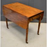 A 19th century mahogany drop leaf table with single drawers turned legs and casters 68cm by 49cm