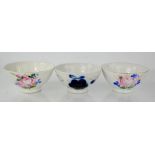 Three Russian 19th century bowls, painted with various flowers, 13cm diameter.