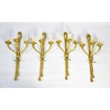 A set of four 19th century style French brass wall lights, each with triple cornucopia form