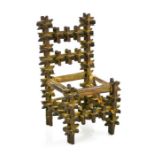 A miniature Tramp Art 'Crown of Thorns' chair, 16cm high.